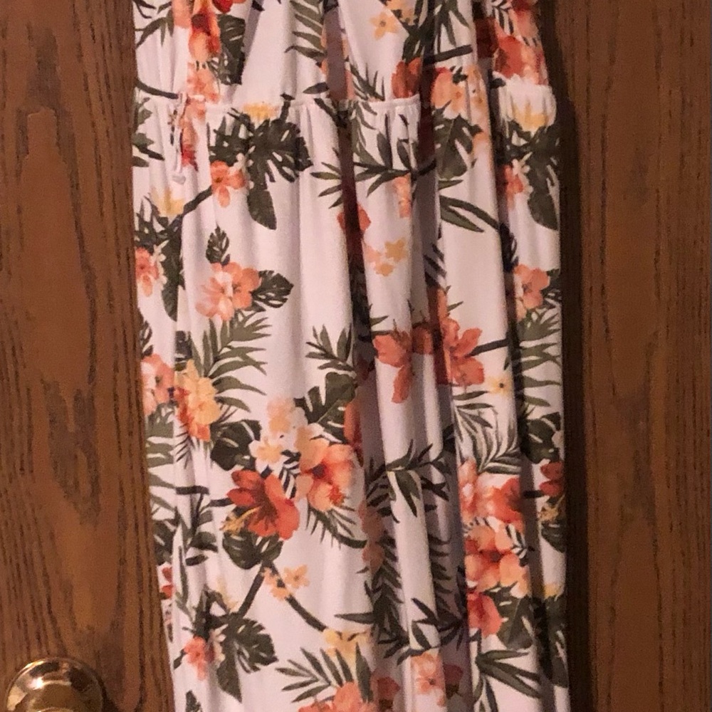 Colorful pant romper with lacy back.